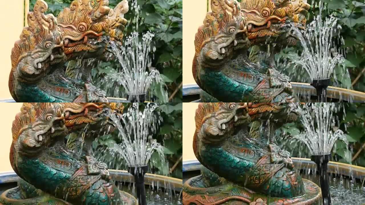 三头绿龙是传统佛教的象征。泰国花园中的龙雕像和龙喷泉