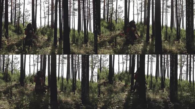 蒙古弓箭手用武器穿越茂密的森林