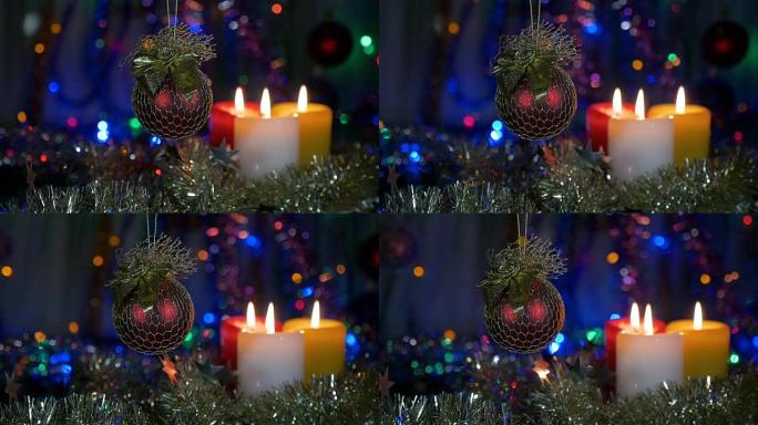 圣诞装饰品，红球。模糊美丽的背景，闪烁的灯光。摄像机在物体周围的运动。