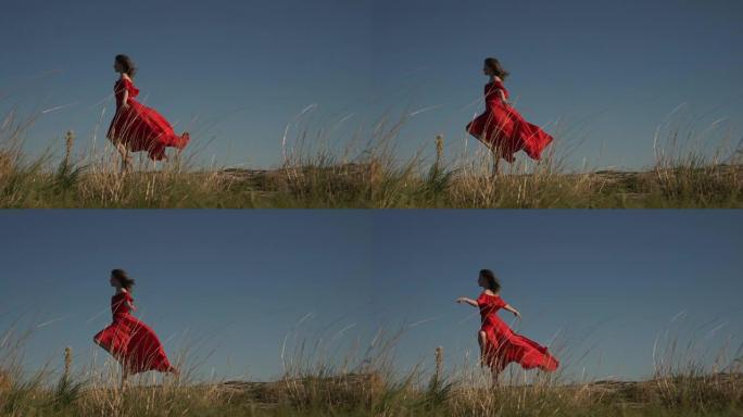 穿着飞行服的赤脚女人在草地后面的背景中