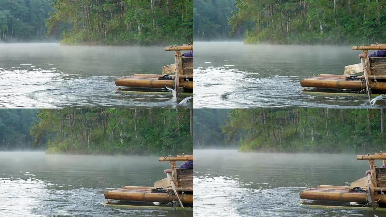 泰国湄宏顺庞雄早上在湖上漂浮的竹筏上的木船桨的特写镜头