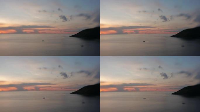 帆船在海浪上滑行。日落背景上的云景。卡塔海滩视点。镜头宝贝甜美的35毫米。泰国普吉岛