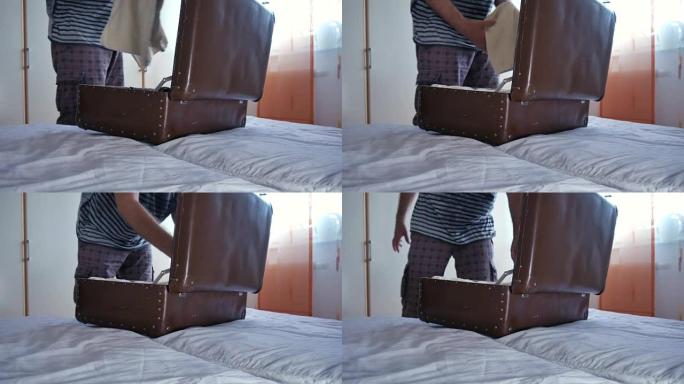 一个男人在度假时收拾行李