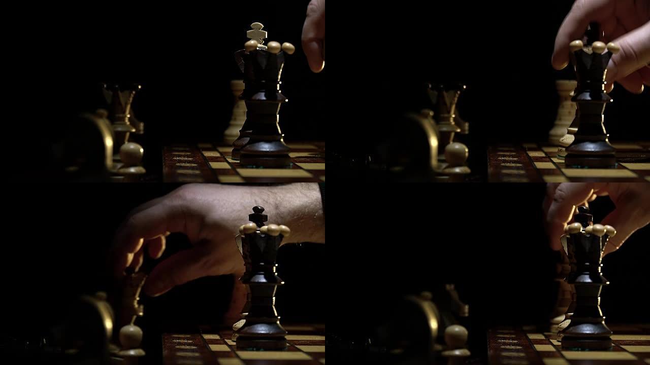棋盘和国际象棋，一个人的手移动了一个木人