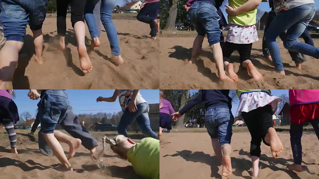散落在沙子上的一群孩子扬起灰尘。