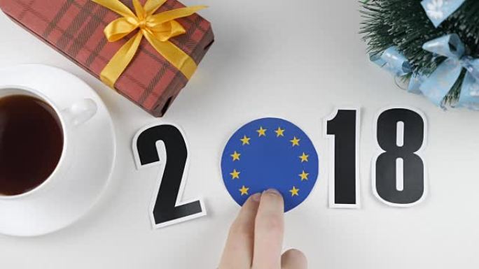 插图，新年，男性手放在桌子上欧盟国旗，cauntry球，2018