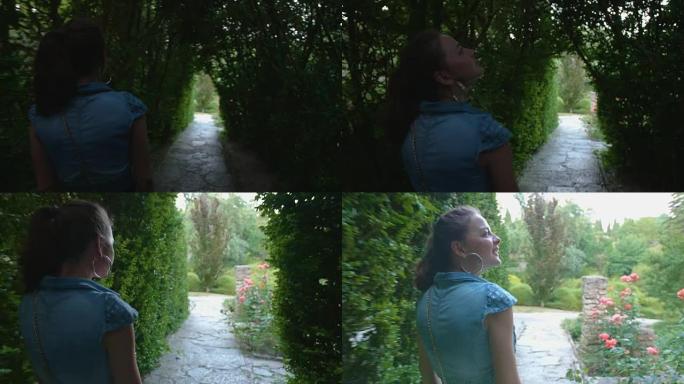 年轻女子走过树木的隧道