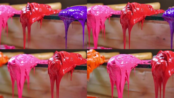 特写紫红色和粉红色正在滴水