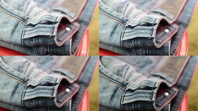 蓝色牛仔牛仔裤的特写细节，纹理背景