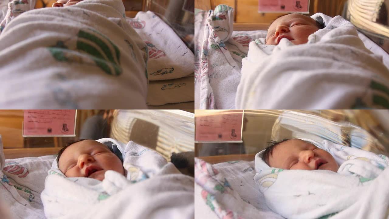 一名新生婴儿出生后在医院婴儿床睡觉