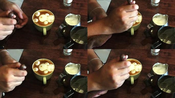 咖啡师在木桌上创作拿铁艺术