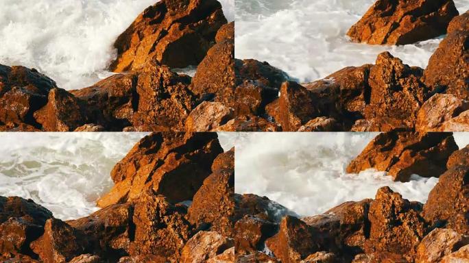 海浪拍打着多岩石的海岸。美丽的南海海浪特写