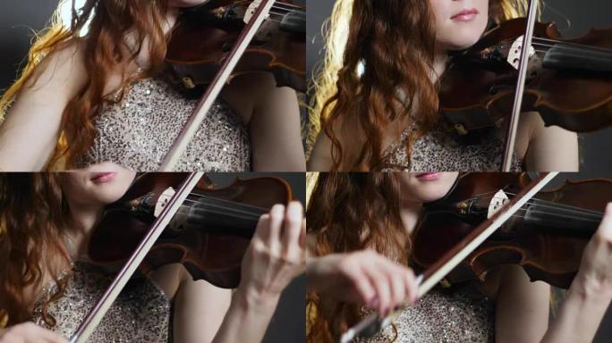 音乐之夜，年轻女性在小提琴弓上演奏