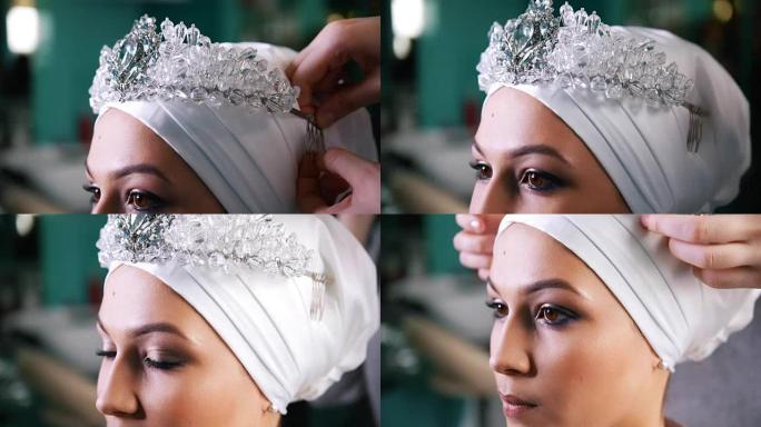 美丽的穆斯林新娘戴着头饰头巾