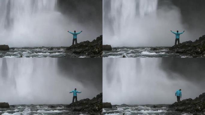 站在巨大瀑布附近的人。