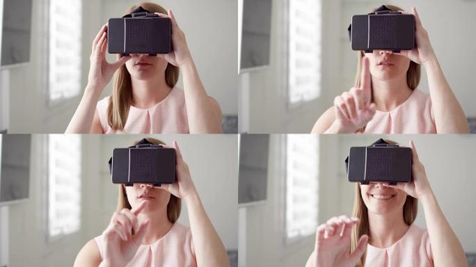 年轻女子在家中使用VR虚拟现实360眼镜。进行浏览、缩放和点击手势