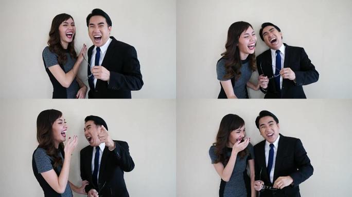 两个快乐的年轻商人笑了。