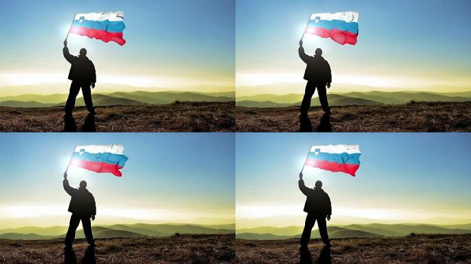 成功的剪影男子获胜者在山顶上挥舞着斯洛文尼亚国旗，4k电影院