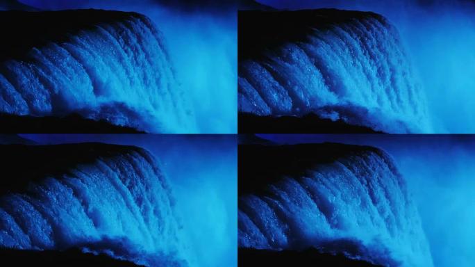 尼亚加拉瀑布有夜间照明。在蓝光下点亮。4k慢动作视频