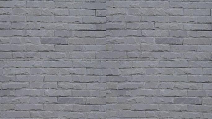 灰色砖墙背景的平移镜头