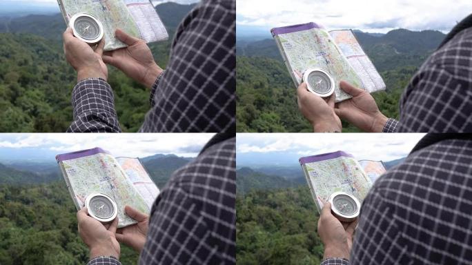 亚洲男子游客看指南针和地图，泰国