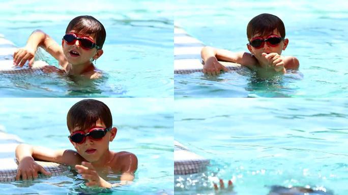 孩子屏住呼吸在水中潜水，然后再次浮出水面。小男孩沉浸在水下