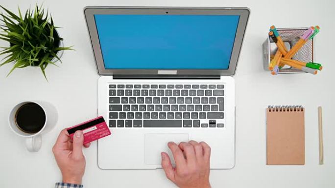 A Man's Hands Typing on the Laptop