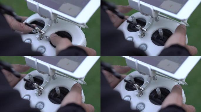 使用遥控器拍摄带有无人机摄像头的航拍视频的家伙