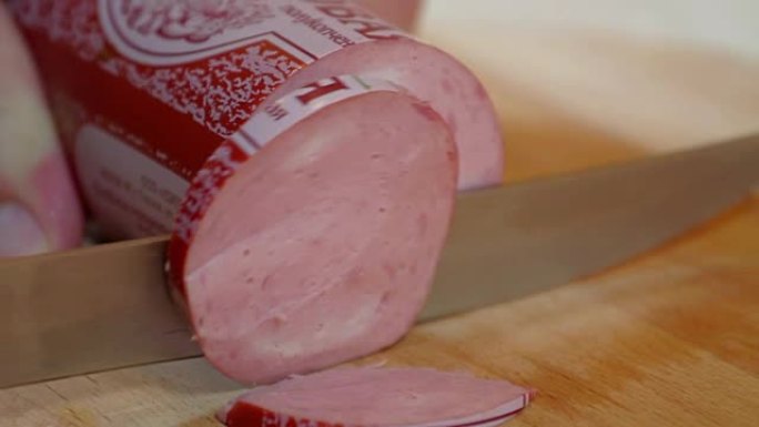Using knife for smaller pieces cut of salami