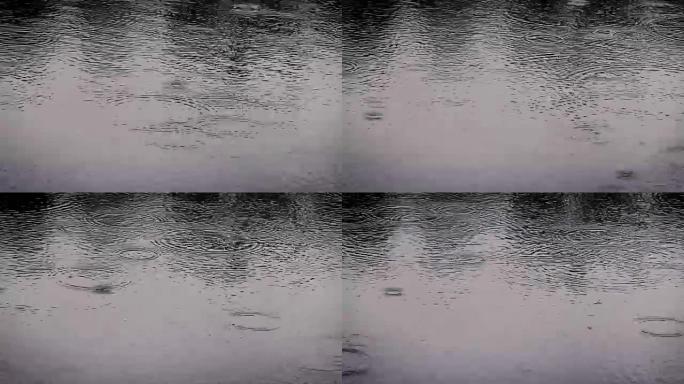 雨季近距离雨滴落到河面的暗色调，4K Dci分辨率