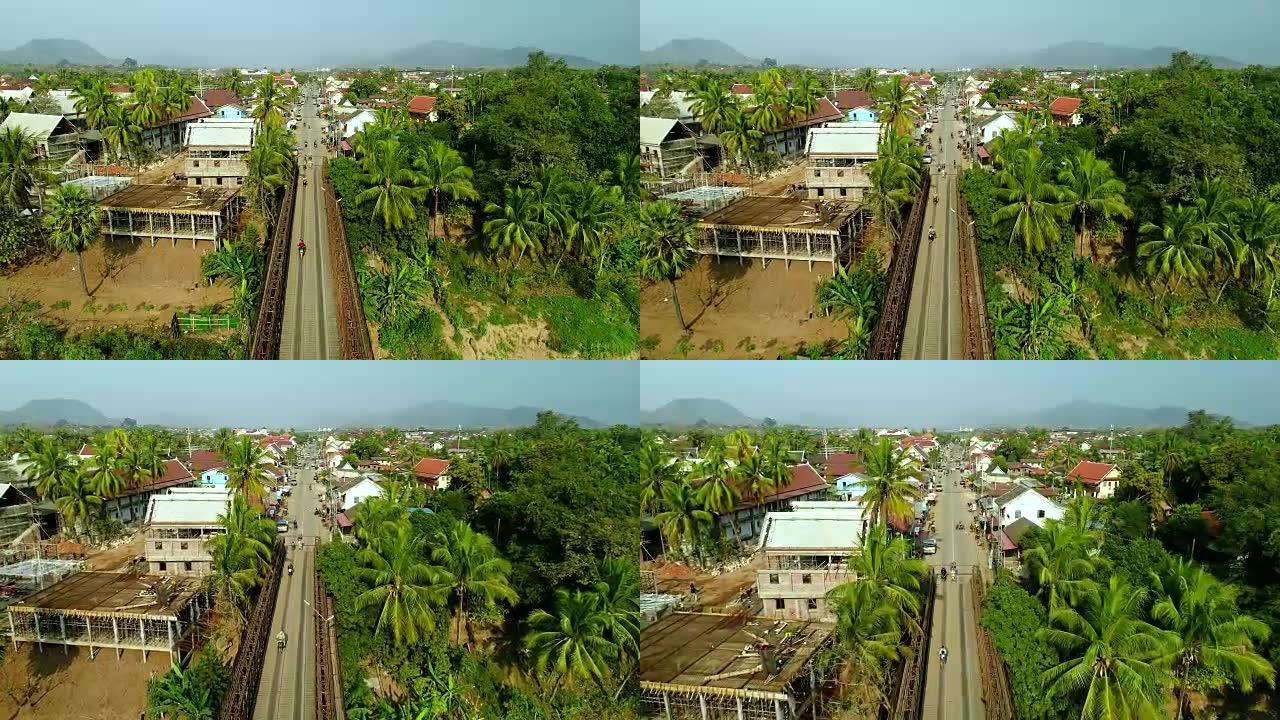 无人机拍摄的4k视频鸟瞰图。老挝湄公河上历史悠久的琅勃拉邦。城市中的道路。