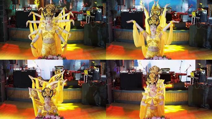 穿着中国传统黄色服装的五名亚洲女女演员跳舞蹈多臂女神