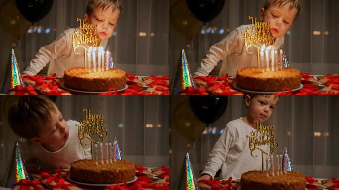 男孩在生日蛋糕上吹牛