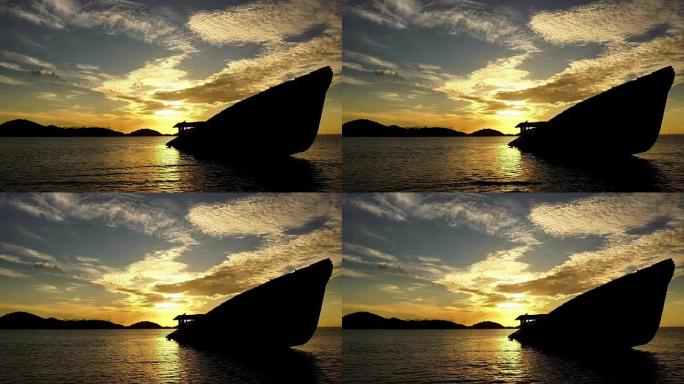 泰国普吉岛安达曼海海滩上的沉船，美丽的日出或日落