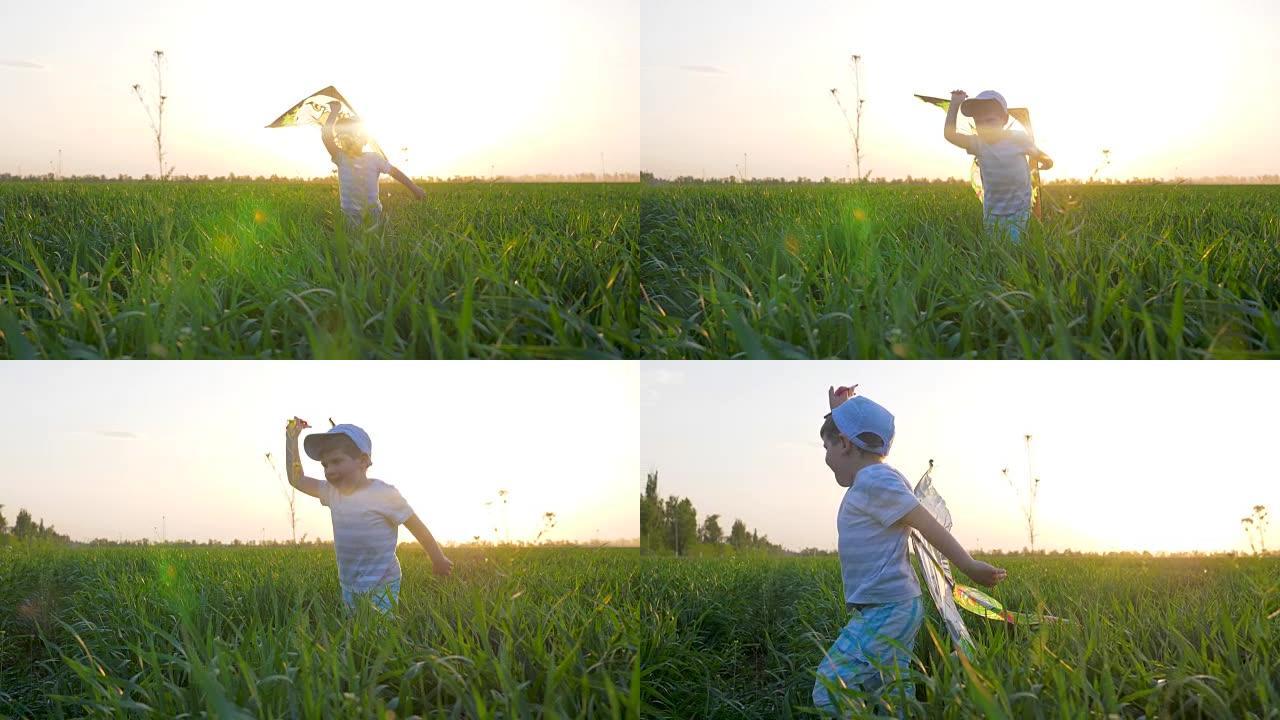 高兴的孩子男孩带着风筝在背景天空的阳光下在绿草丛中奔跑