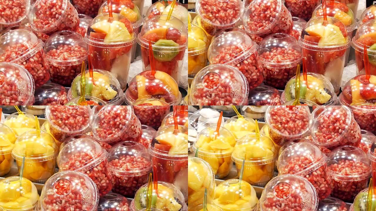 新鲜包装在水果西瓜，猕猴桃，梨，苹果，芒果，石榴，草莓的塑料玻璃混合物中