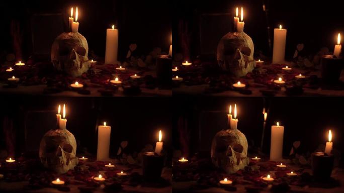 带有蜡烛和飞刀的神秘仪式头骨