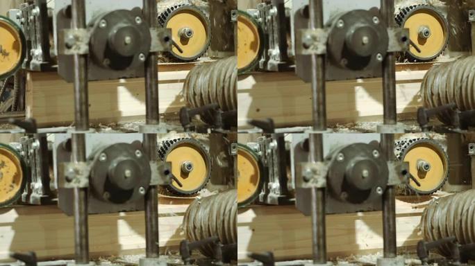 锯木厂生产中的棒材精炼机纺纱轮
