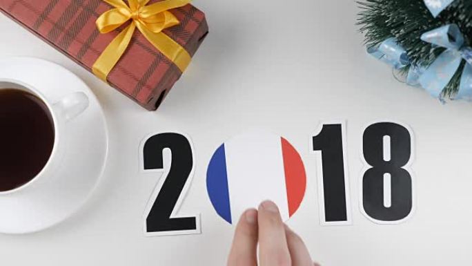 插图，新年，男性手放在桌子上法国国旗，cauntry球，2018