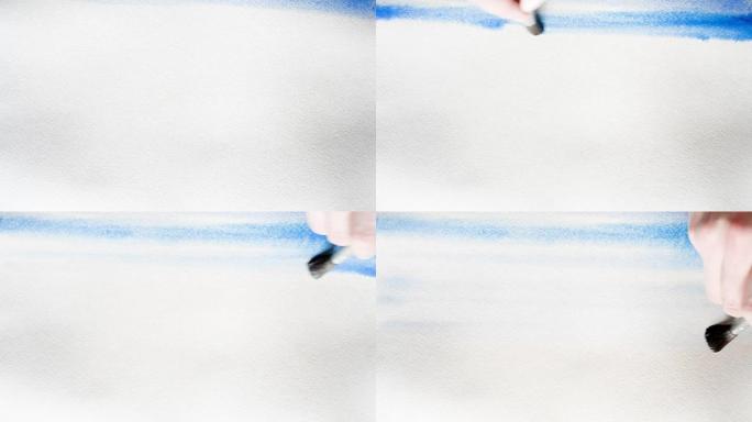 艺术家用蓝色水彩画覆盖了一张湿的厚纸。背景，非常接近