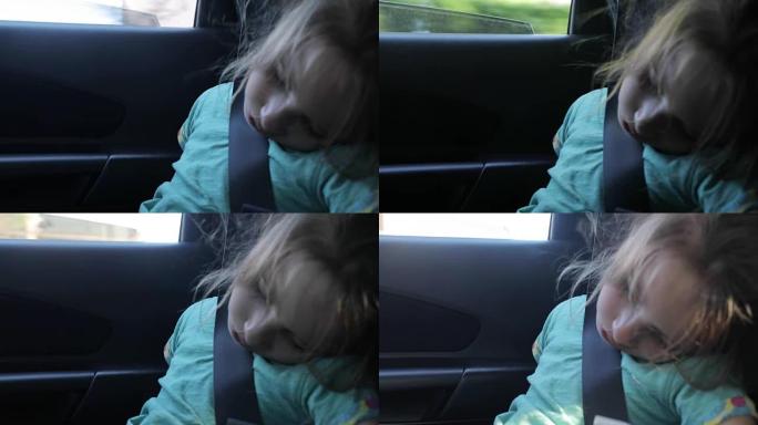 年轻女孩在旅行时在车里睡着了