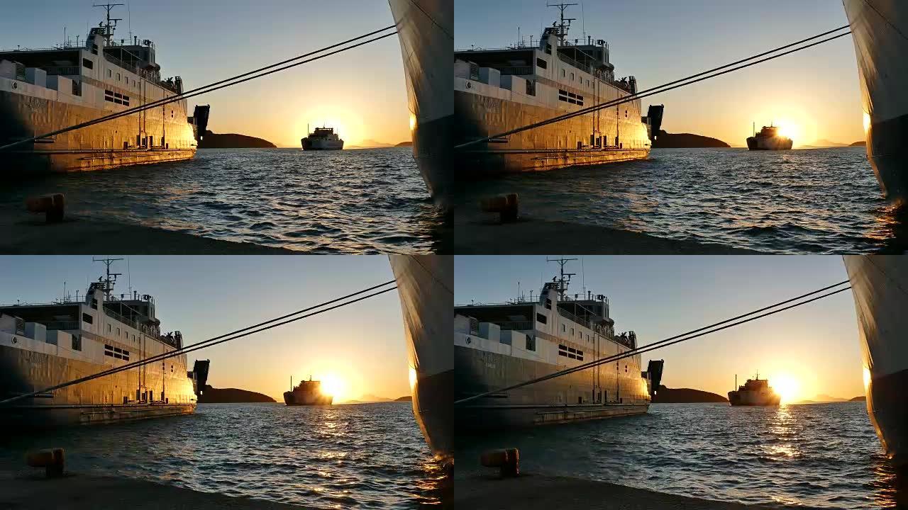 伊古梅尼察港美丽的金色日落。希腊伊古梅尼察海港的渡船。