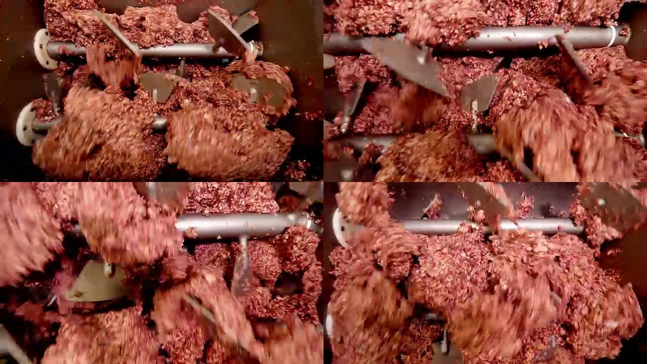 在肉厂特写镜头的巨大绞肉机上加工猪油或肉。
