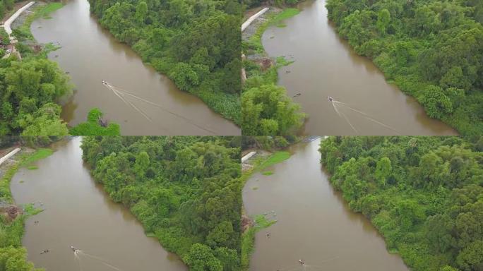 河流中的长尾船，乡村河流和树木的鸟瞰图
