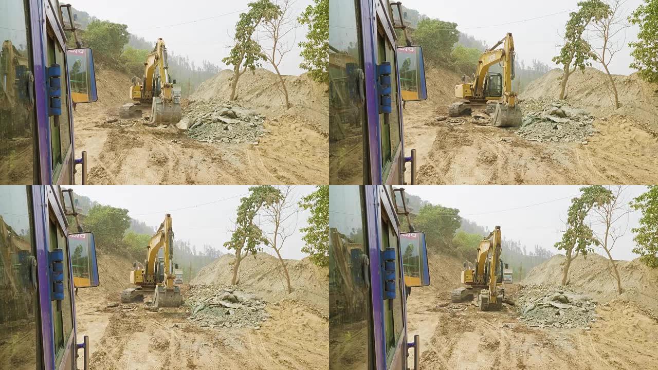 挖掘机修理尼泊尔的道路。