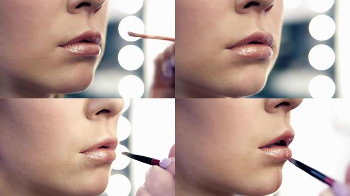 专业化妆师在美容院工作的模特嘴唇上涂抹口红的特写视图。使用特殊笔刷的艺术家手的特写视图