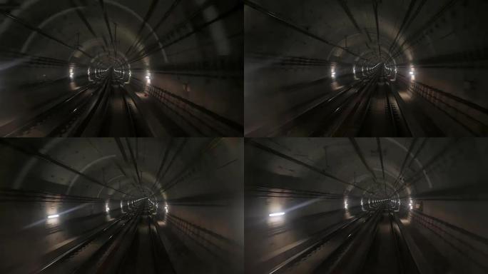 从前进列车的前窗看到的地铁隧道视图。在现代城市的隧道中乘坐快速地下火车。巴塞罗那沿其路线行驶的地下火