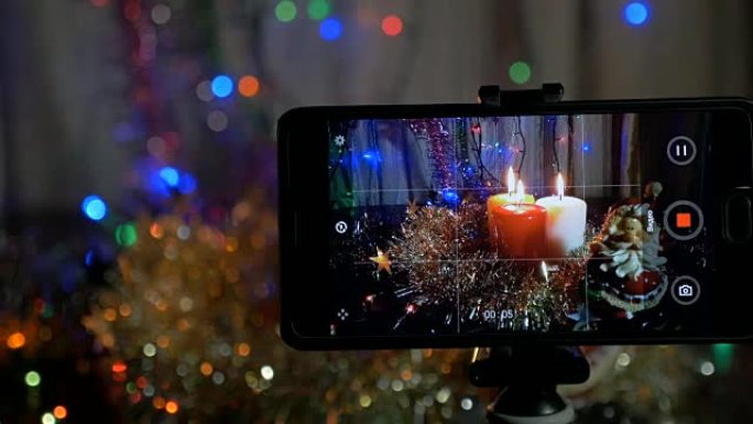 新年的背景，在前台，一个智能手机上录制了一个视频。