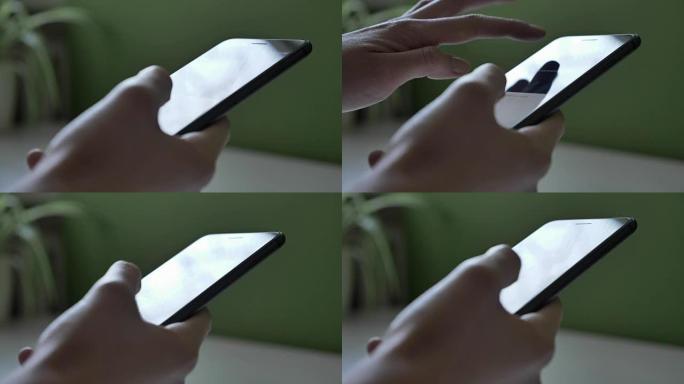 女性双手使用黑色大智能手机，背景中有一张阳光充足的桌子，特写60 fps