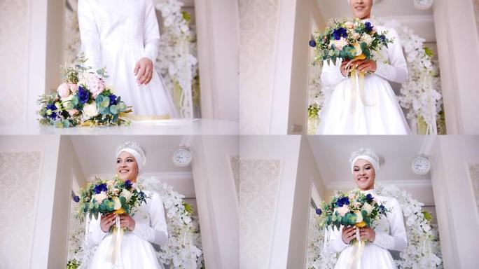穿着白色婚纱化妆的美丽穆斯林新娘来到鲜花前